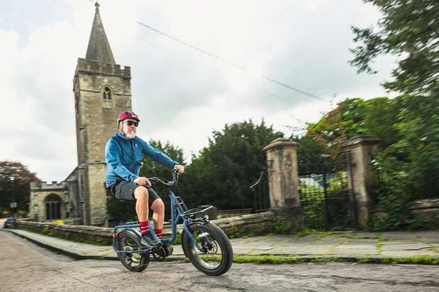 Male cyclist in blue riding the Benno Bikes RemiDemi 9D eBike